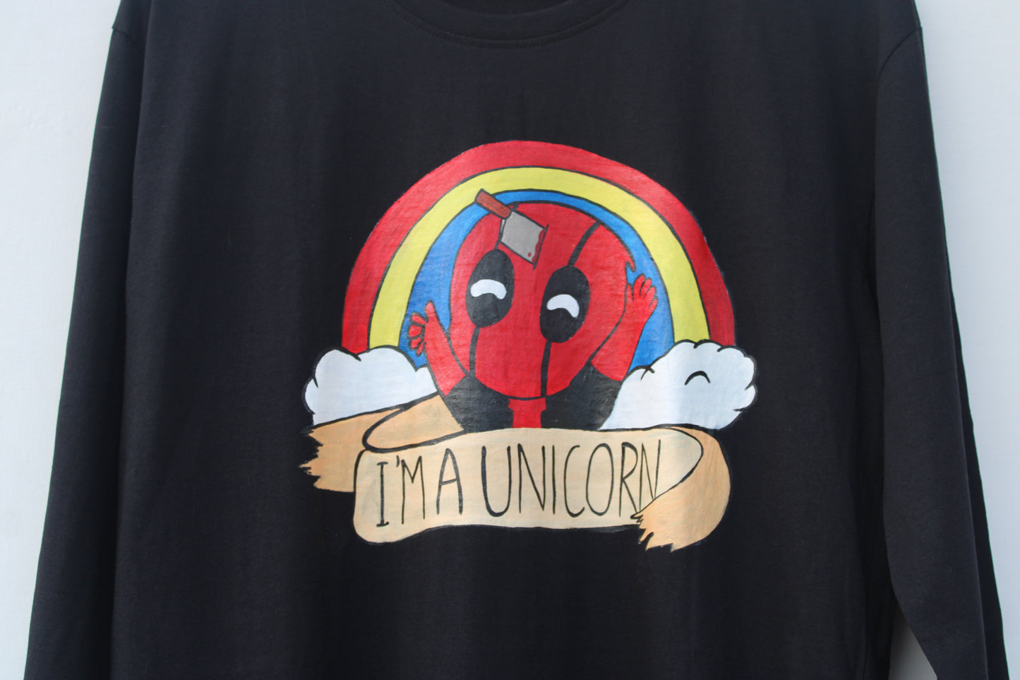 Detailed shot of Deadpool T-shirt design, highlighting the vibrant colors and textured artistry.