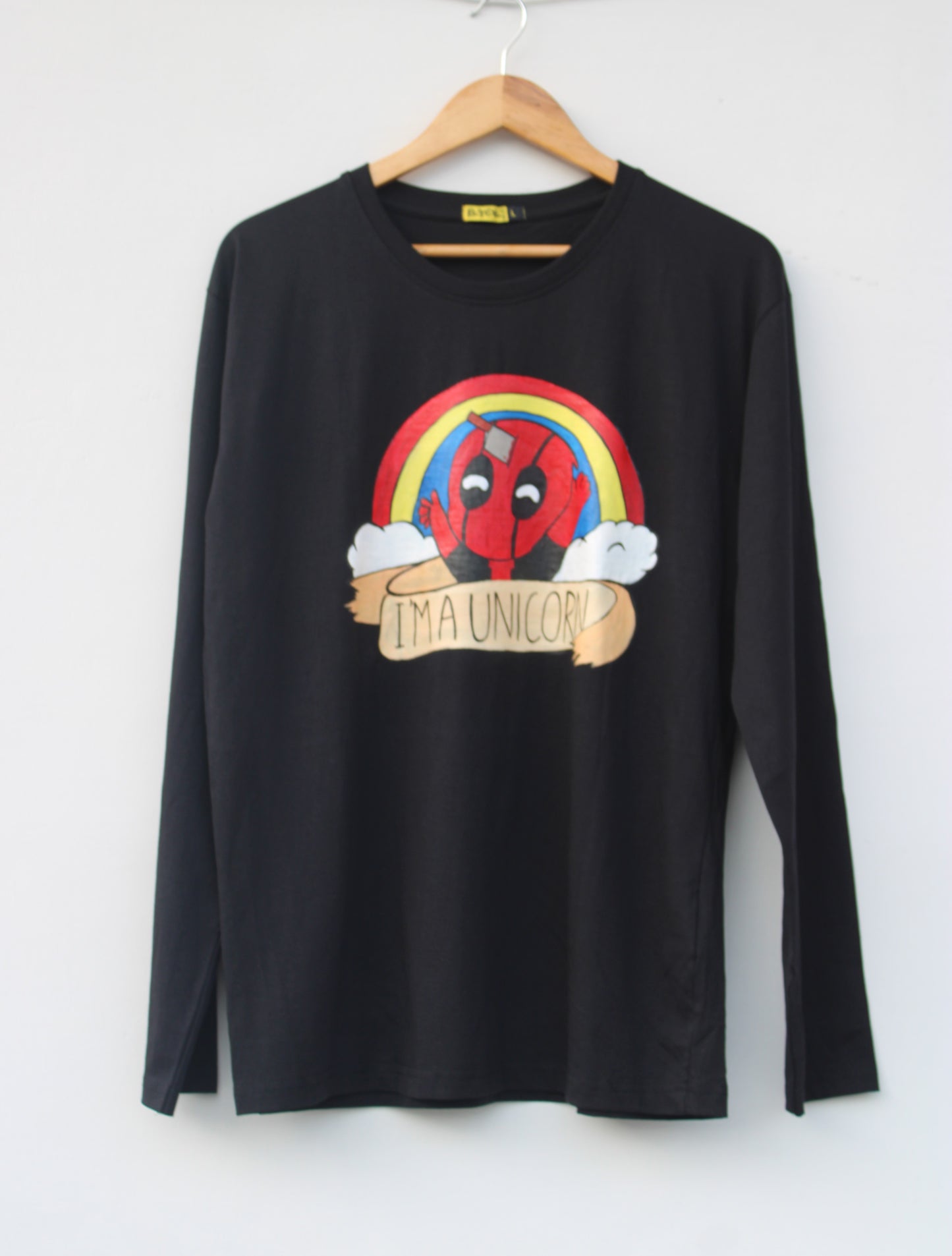 Full view of a black hand-painted Deadpool T-shirt (long sleeve) on a hanger, showcasing the whimsical design.